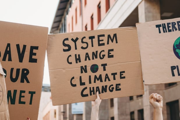 Climate activists stage Grinch-themed protest at AIG headquarters